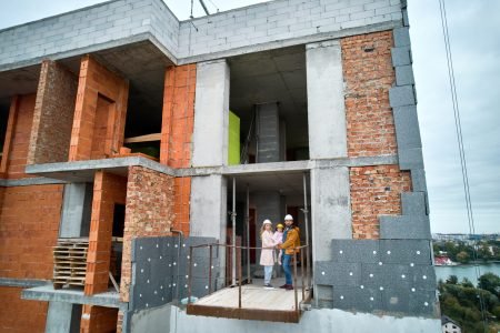 family-standing-inside-building-under-construction-2025-01-16-23-48-27-utc